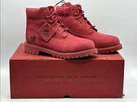 Both boots on top of original red box showing overall style and condition