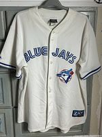 Front view showing Blue Jays script, logo patch, buttons, sleeve trim