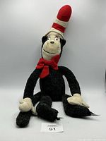 Front view of full Cat in the Hat plush seated