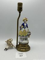 Full view of porcelain lady lamp without bulb