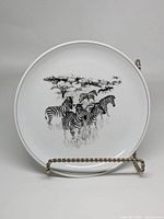Front of porcelain plate showing zebra illustration
