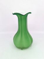 Full view of green glass vase showing shape and color