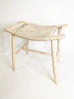 Three-quarter view of bench showing overall form, legs and seat