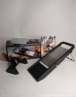 Full set showing slicer, hand guard, blade box, manual and retail box