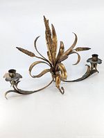 Full view of ornate brass-tone double arm candle holder
