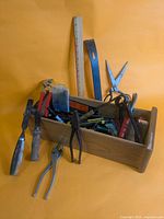 Overall lot view showing wooden toolbox and main tools