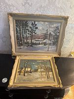 Two framed paintings stacked, main lot on top