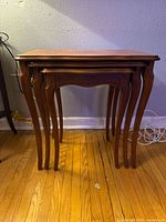 Side view of stacked nesting tables