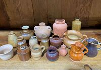 Full grouping of miniature pottery pieces on table