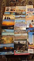Tabletop spread of approximately 30 unused postcards showing various New Jersey and Pennsylvania scenes