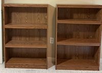 Front view of both bookcases showing three shelves each