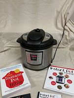 Instant Pot with two cookbooks arranged in front