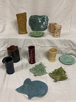 All 13 pottery pieces displayed