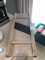 Top view of entire wooden slicer showing frame, rails and angled blades