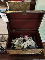 Open jewelry box showing assorted costume jewelry inside
