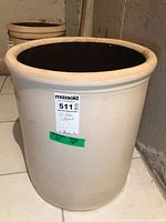 Front view of 10 gallon Crown crock showing exterior glaze and size