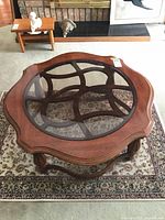 Top view of round wood coffee table with glass insert