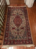 Full view of rug displaying pattern, colors and size