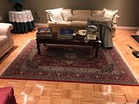 Full view of area rug placed under coffee table showing overall size and color