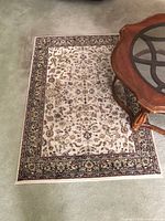 Full view of rug showing entire pattern and border