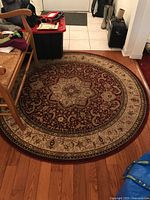 Full view of round rug on hardwood floor