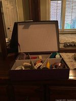 Box with multiple watches visible in compartments