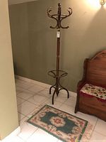 Full view of coat rack and rug