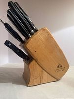 full view of wood block holding knives and utensils