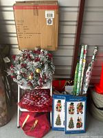 Overall lot with boxed wreath, displayed wreath, wrapping paper rolls, silhouettes, storage bag