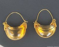 front view of both MMA half-moon citrine earrings