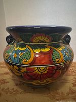 Front view of multicolored ceramic planter