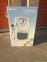 Front of boxed Memorex MKS 8503 karaoke system showing product image and branding
