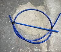 Coiled blue PEX pipes showing both pieces