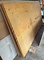 Stack of two full plywood sheets showing faces and edges