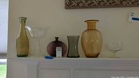 All six glass pieces lined on mantle