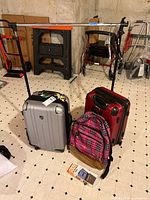 Overview showing both suitcases, backpack, packaged Bag Bungee strap and garment rack