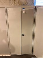 Front view of closed two-door metal cabinet