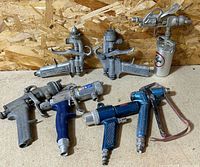 Group shot of all nine pneumatic tools laid out