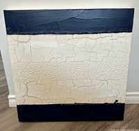 Full view of square abstract painting showing crackle texture and black borders