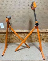 Side view of one stand highlighting frame and roller head