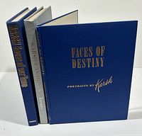 Spine view of three hardcover books without jackets