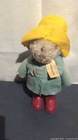 Full view of Paddington Bear plush wearing hat, coat, boots