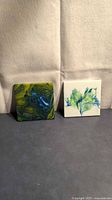 Both ceramic tile art pieces side by side