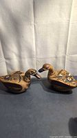 Both pottery duck figurines side by side