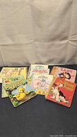 Stack of eight vintage Little Golden Books displayed