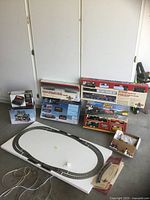 Lot overview showing boxed sets, track, accessories