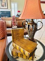 Lamp with shade and two closed book-form boxes