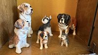 All six ceramic dog figurines front view