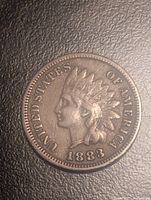 Obverse view of 1883 Indian Head cent showing date and legend