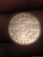 Reverse with large numeral 5, maple leaves and date 1927